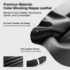Close-up of a black color-blocking nappa leather steering wheel cover showing fine texture and stitching.