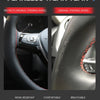 Close-up view of a black steering wheel cover designed to protect the original steering wheel, featuring wear-resistant and b