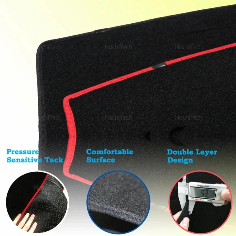 Close-up view of a black custom dashboard mat with red stitching and a textured surface.
