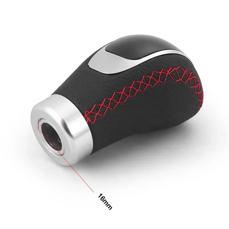 A close-up view of a black gear shift knob with a silver accent and red stitching, showing a 16mm diameter.