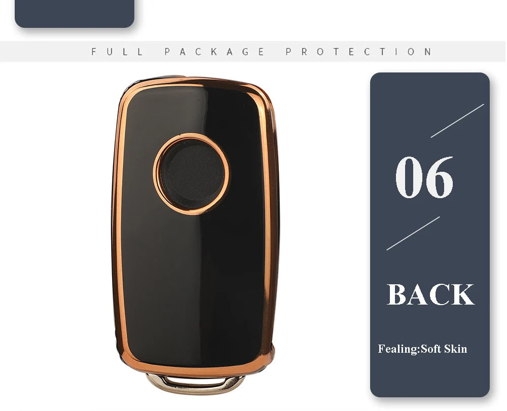 A black silicone TPU car key cover protector with a round indentation and gold trim.