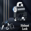 A close-up view of a heavy duty helmet lock mechanism and a set of keys against a dark background.