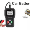 A black car battery tester device with voltage indicators and testing leads is shown next to various voltage labels.