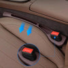A dual car seat gap filler organizer is shown inserted into the gap between car seats in a vehicle interior.