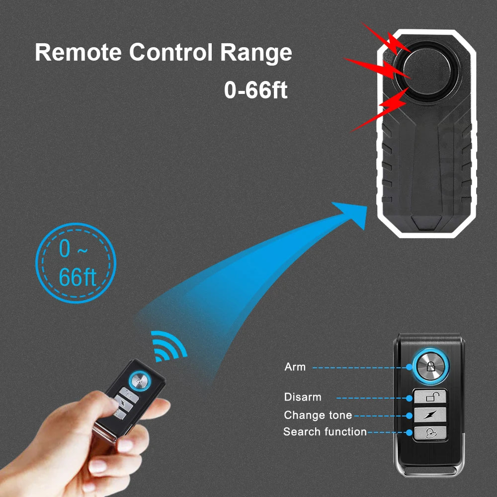A hand holds a remote control for a wireless alarm system, demonstrating its 0-66ft range.
