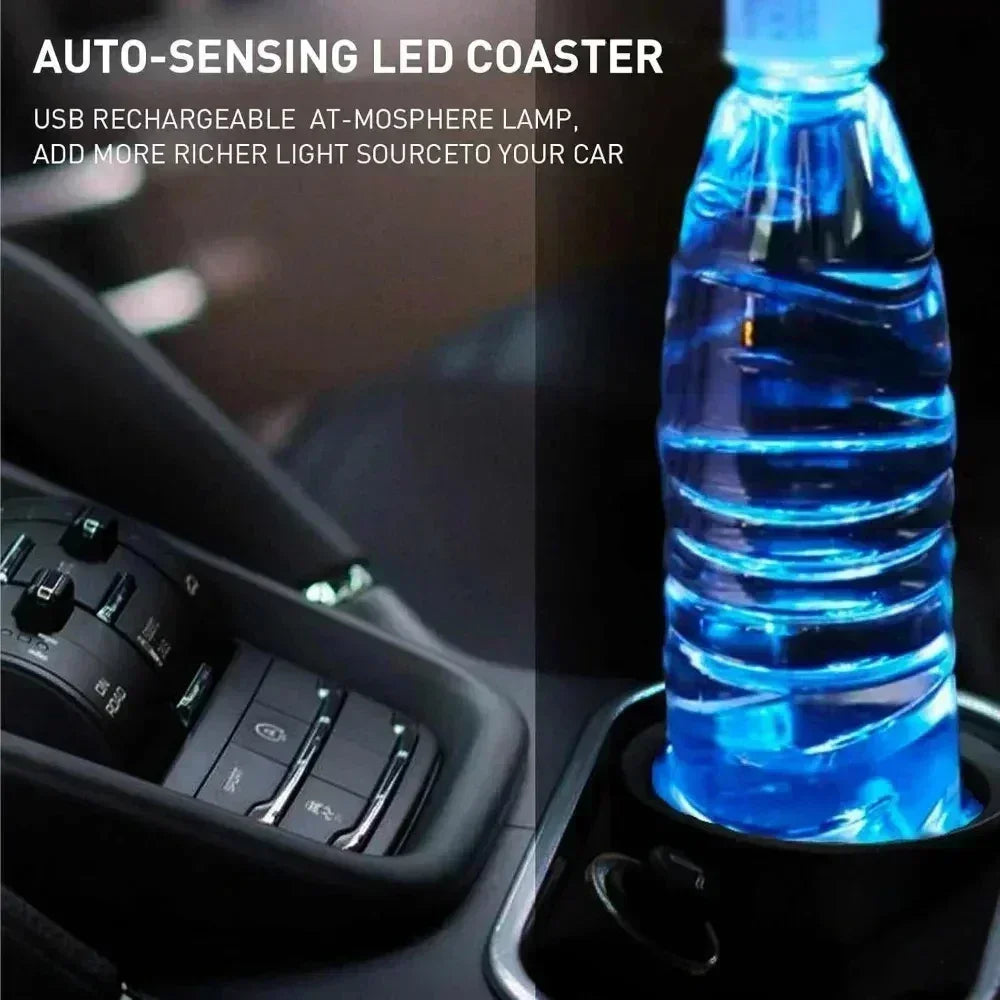 A blue LED coaster bottle is placed in a car cup holder, with a car interior visible in the background.