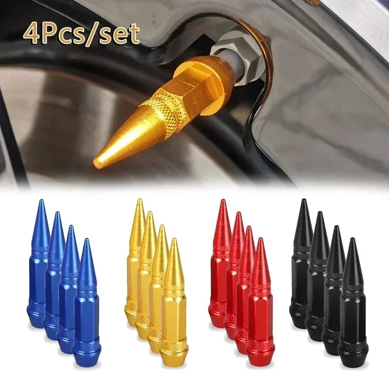 Set of four aluminum tire valve stem caps in various colors including gold, blue, red, and black.