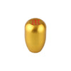 A golden aluminum gear shift knob with markings 135 H and 24 R.