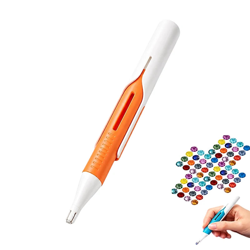 A white and orange precision diamond painting bead dispenser pen is shown next to a hand holding it.