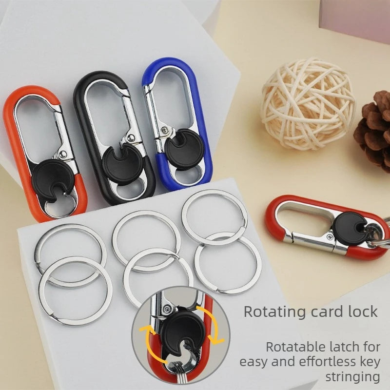A set of rotating card locks and a carabiner keychain are displayed on a white surface.
