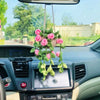 Strawberry crochet hanging decor with pink and green flowers suspended from the car rearview mirror.