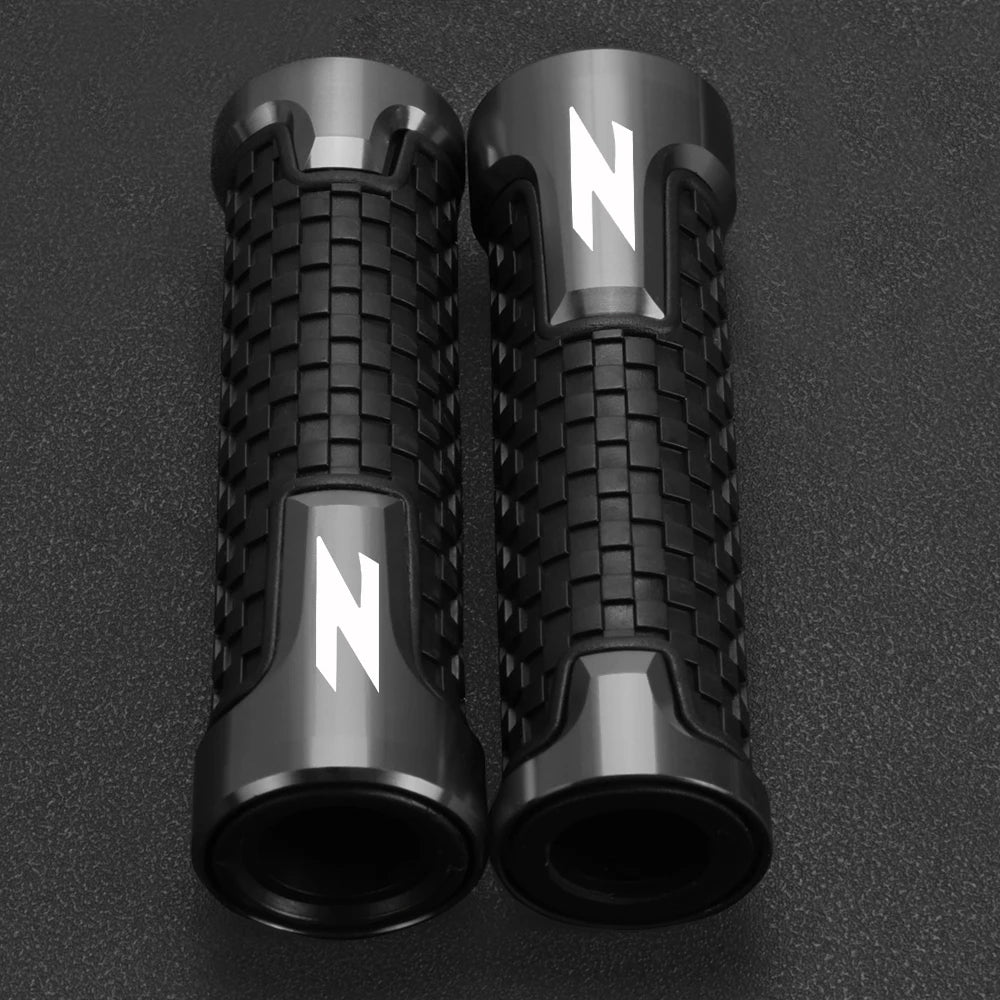 A pair of black motorcycle lever and handguard protector sets with silver 'N' markings.
