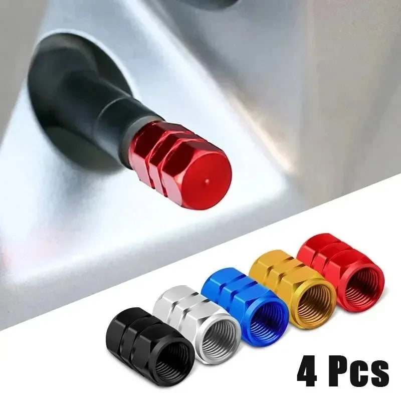 Four red and black aluminum valve caps for wheels and tires