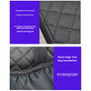 Close-up of a black microfiber armrest pad with quilted stitching and an elastic edge trim.
