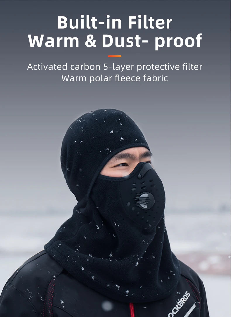 A man wearing a black built-in filter warm and dust-proof fleece balaclava in an outdoor setting.