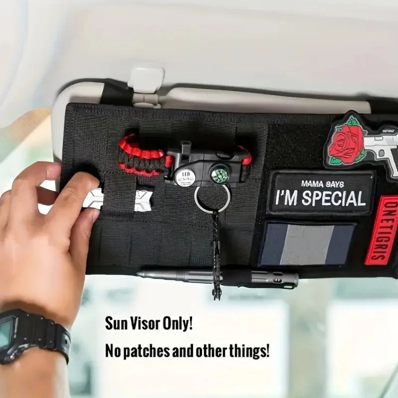 A black tactical visor organizer with a MOLLE pouch is shown inside a car, featuring a rose emblem and a pistol silhouette.