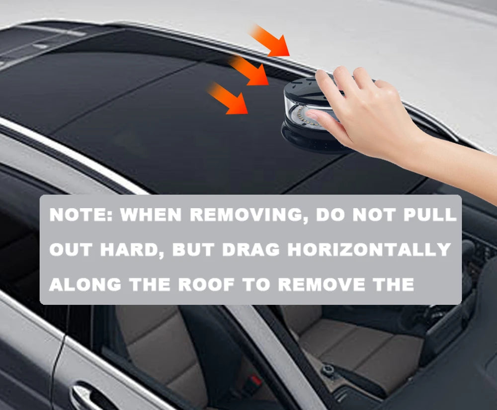A hand is removing an emergency LED strobe light from the roof of a car, demonstrating how to drag it horizontally.