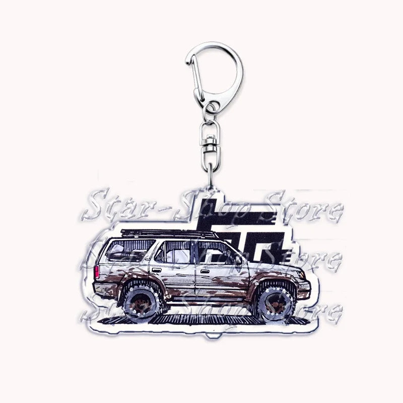Silver acrylic keychain featuring a detailed off-road truck model.