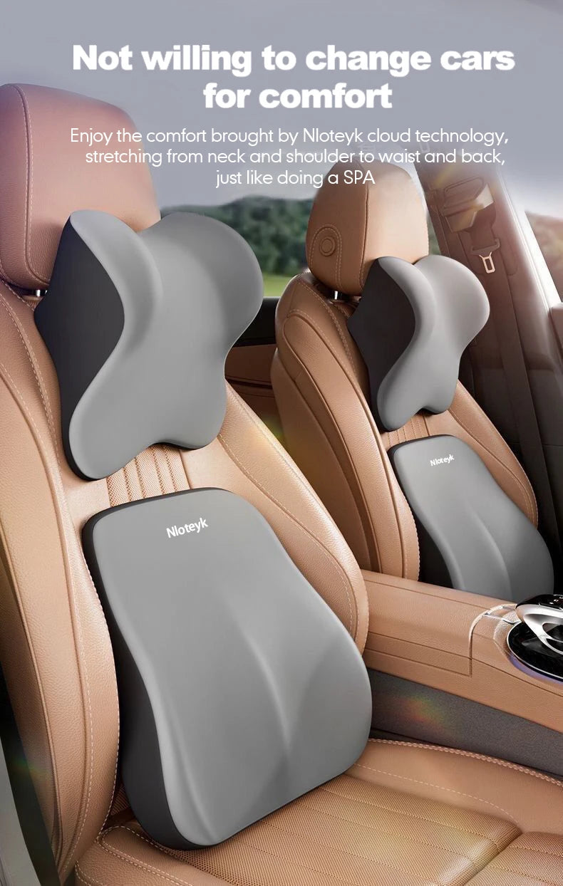 Ergonomic lumbar support pillow in gray and beige leather upholstery for car comfort