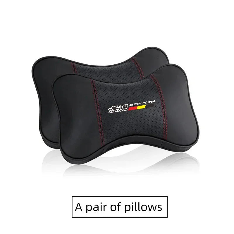 A pair of black PU leather car headrest pillows or seatbelt shoulder pads.