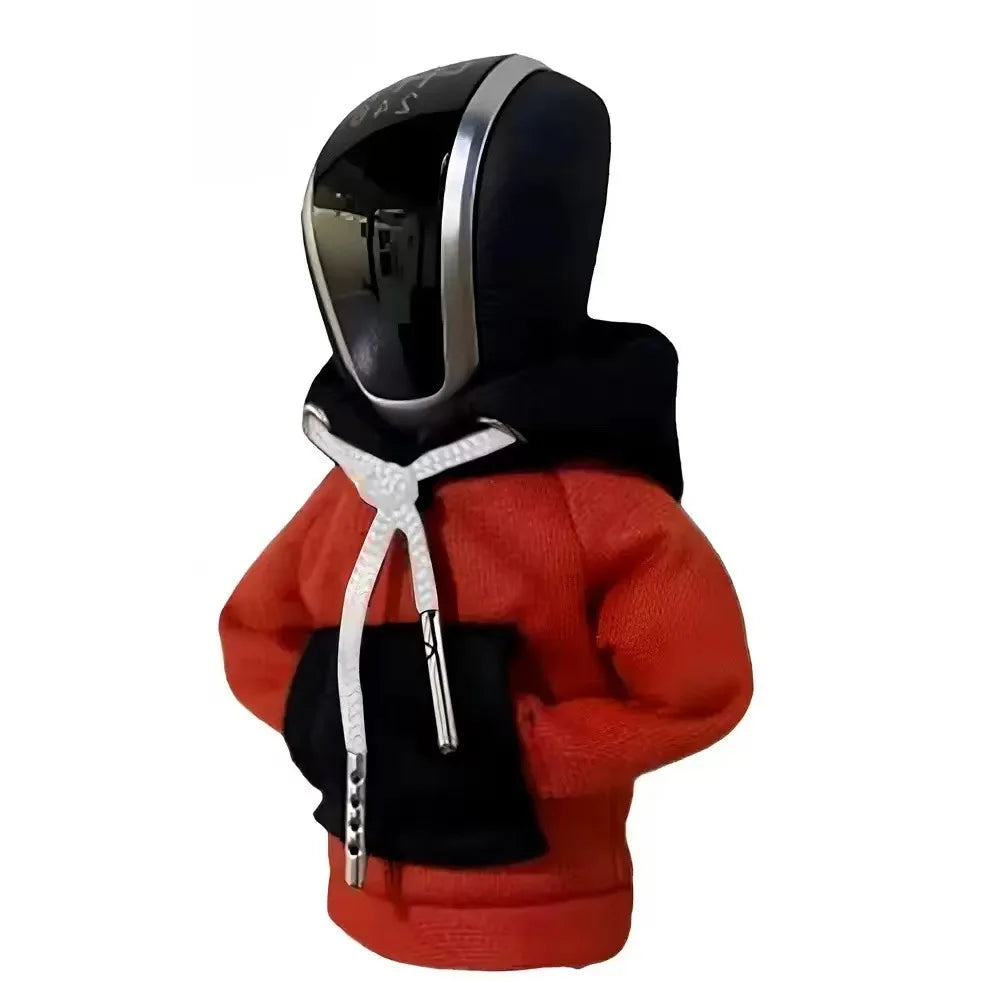 A black and orange cozy knit gear shift cover for manual transmission.