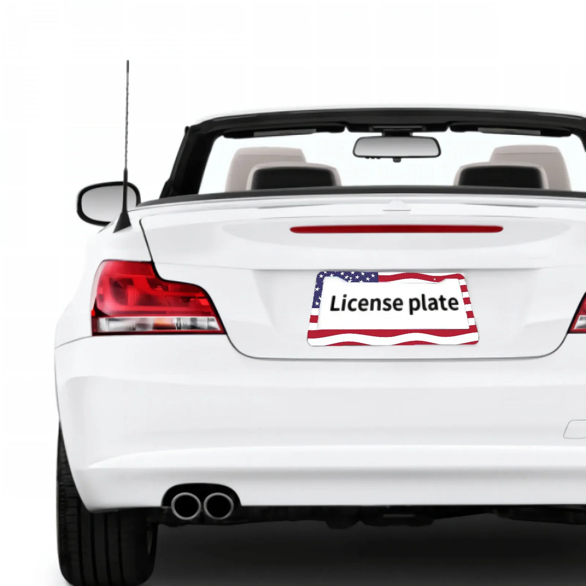 A white car's rear view showing a license plate frame with an American flag design.