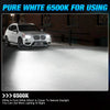 A white BMW SUV is shown with a bright white light beam illuminating the ground.