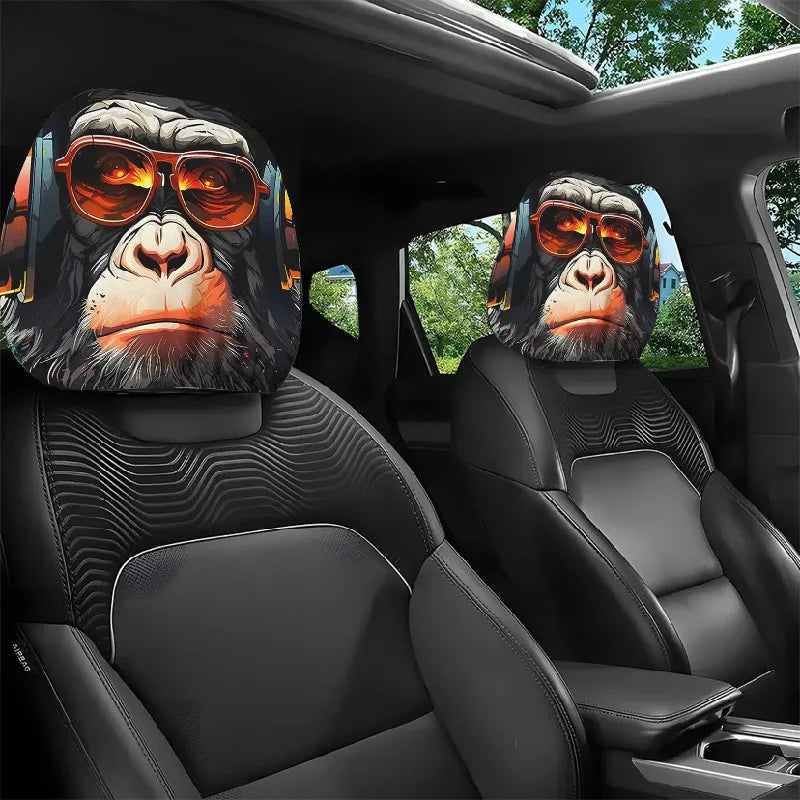 A set of two Halloween horror face car headrest covers featuring gorilla masks and sunglasses installed in a car interior.