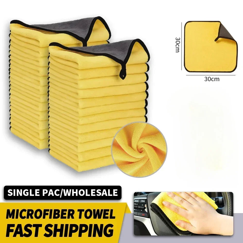 A set of yellow microfiber towels stacked and displayed, with a hand using one on a car interior.
