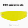 A yellow anti-fog patch for a motorcycle helmet visor, labeled TT-REVO special anti-fog patch.