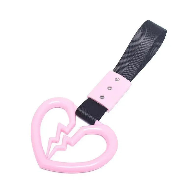 Pink and black strap with a heart charm for a bracelet or accessory.