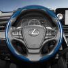 Close-up view of a Lexus steering wheel with blue carbon fiber accents and controls.