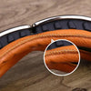 Close-up of retro folding motorcycle windproof glasses with brown leather padding and silver frame.