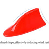 A red, streamlined shape representing a car antenna cover designed to reduce wind resistance.