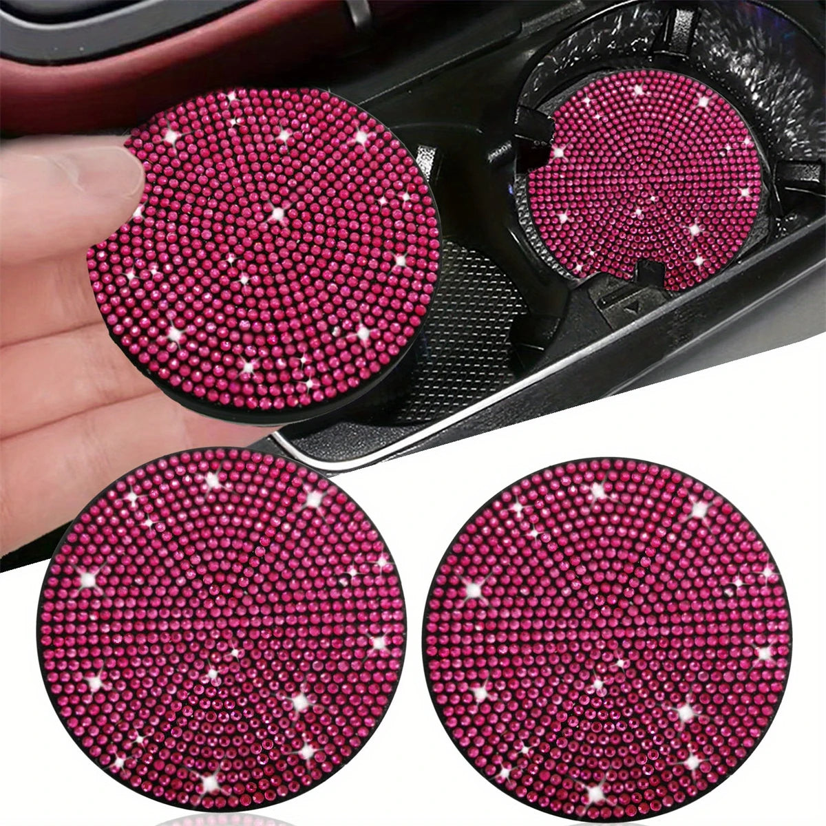 Two round imitation diamond car cup coasters with pink and clear stones shown on a hand.