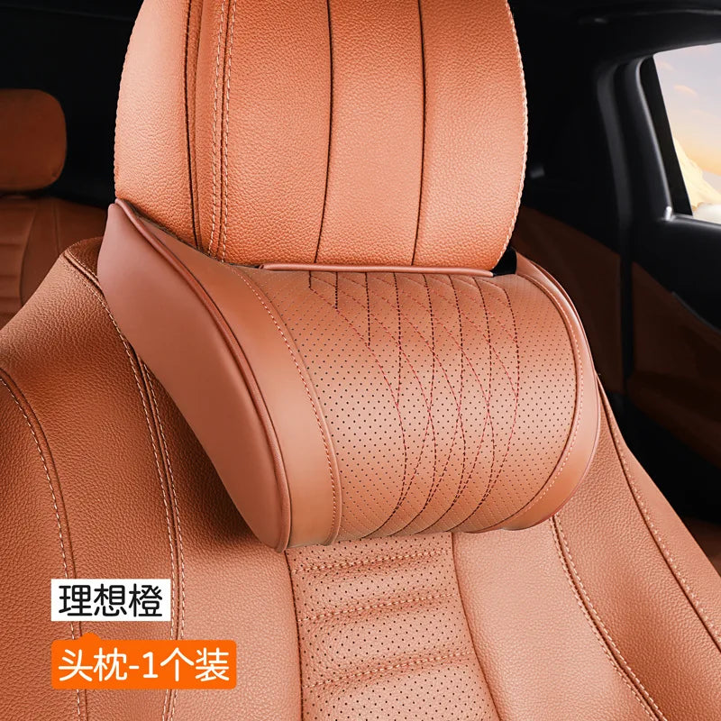 A close-up view of a tan leather car neck pillow designed for enhanced comfort.