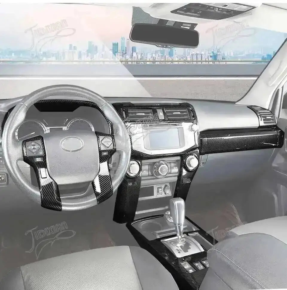 Carbon fiber grain interior decoration for a Toyota 4Runner showing the steering wheel and dashboard.