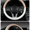 Pink perforated Nappa leather steering wheel cover shown in a car interior display.