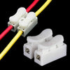 Two white quick splice wire connectors with red and yellow insulated wires.