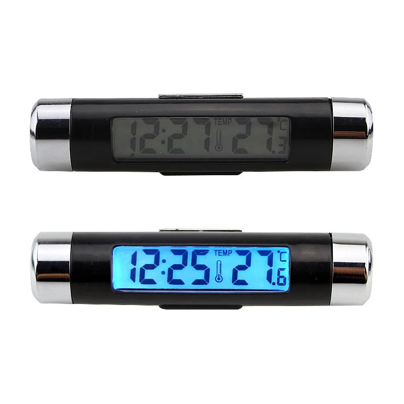 A black and silver digital clock and thermometer with a blue backlight displayed on the screen.