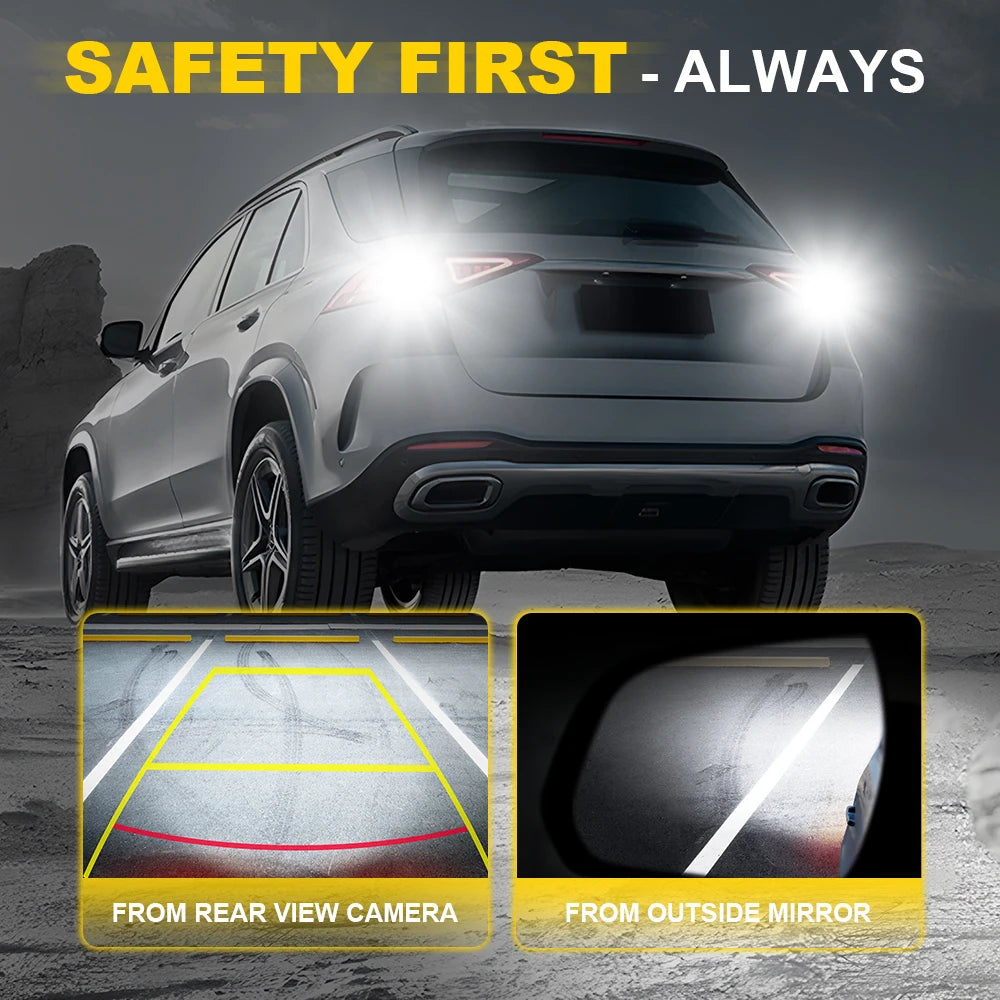 A silver SUV shows safety features including a rear view camera and an outside mirror.
