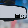 Black cat decal applied to a rearview mirror.