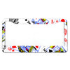 A white license plate frame with a colorful pattern featuring playing card symbols and designs.