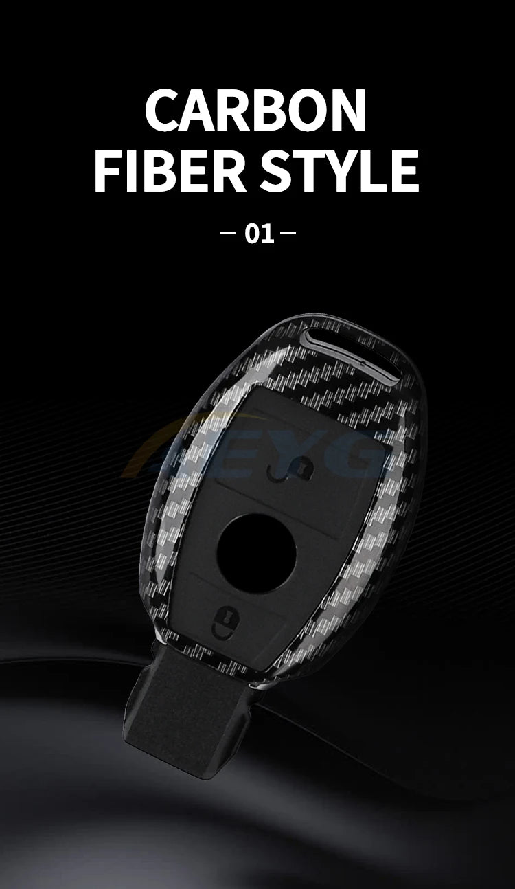 A close-up view of a black carbon fiber style car key cover for Mercedes models.