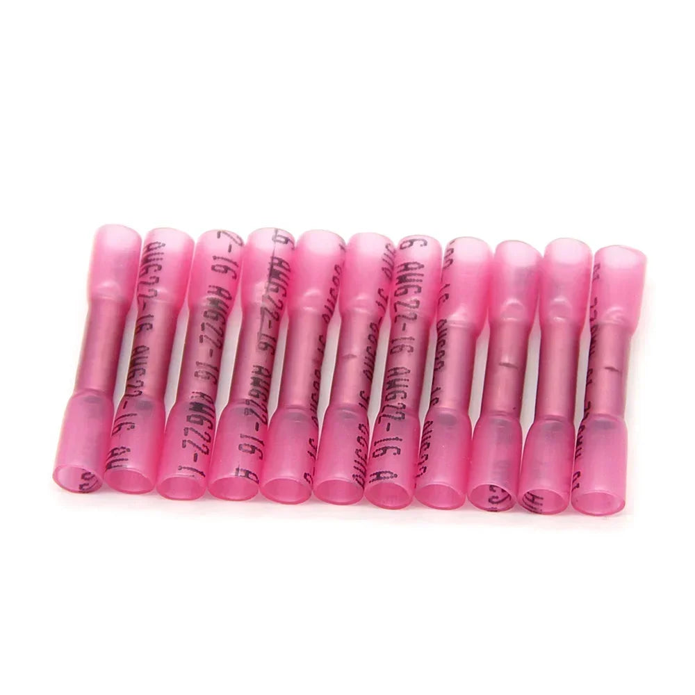 A row of pink durable heat shrink wire connectors.