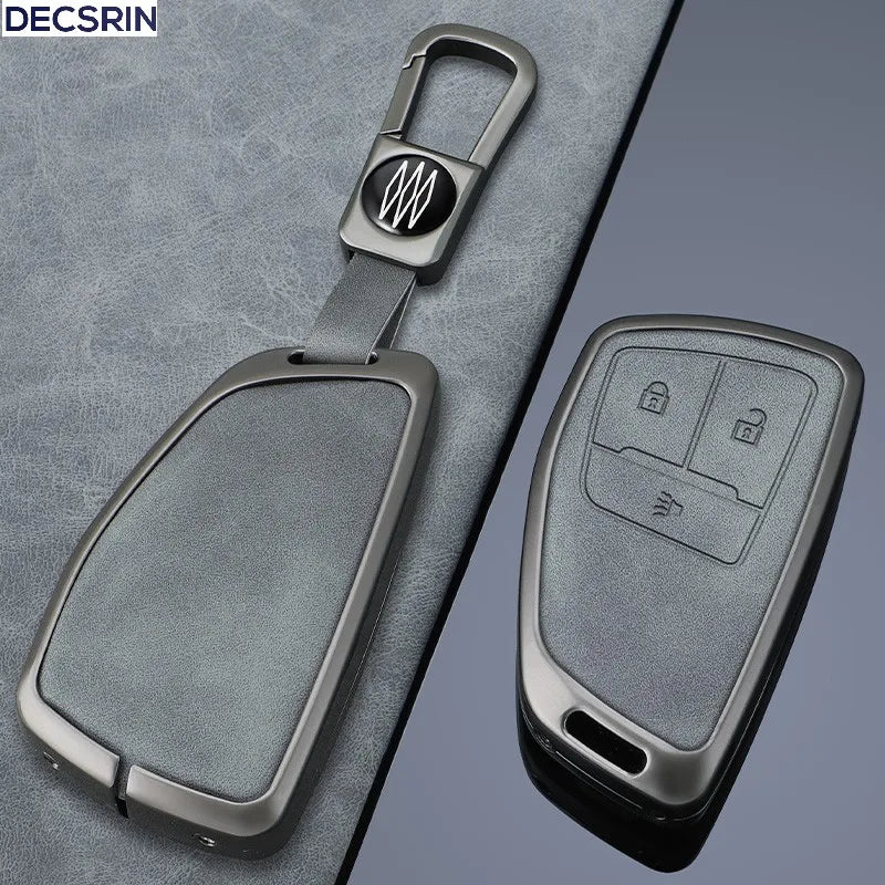 A sleek, silver multi-button car key case cover is shown against a gray textured background.