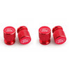 Three red Ford aluminum car wheel valve caps displayed side by side.