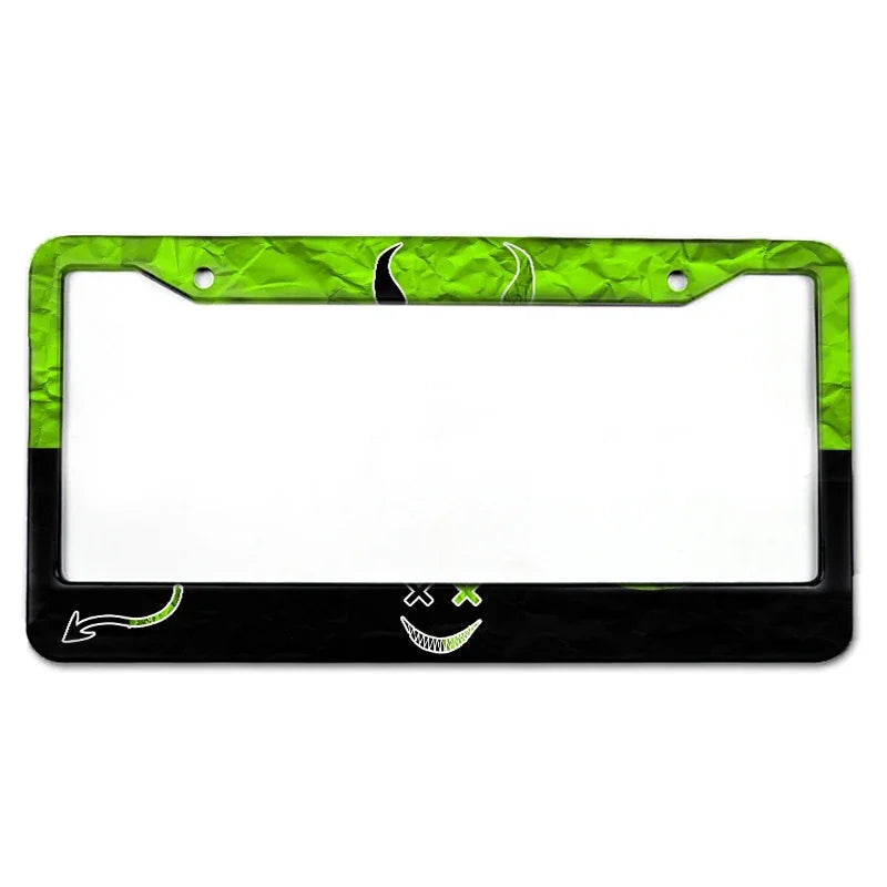 A rectangular aluminum license plate frame with a green, textured border and a black background.