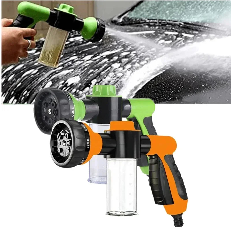 An orange and black high pressure foam lance car wash sprayer is shown spraying water on a car surface.