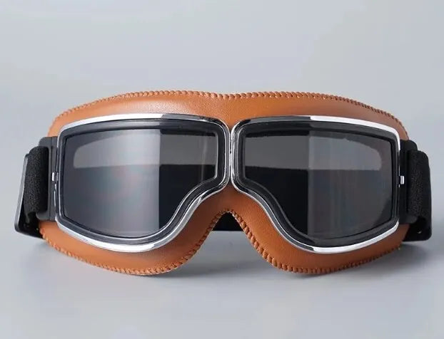 A pair of retro folding motorcycle windproof glasses with brown leather and black frames.